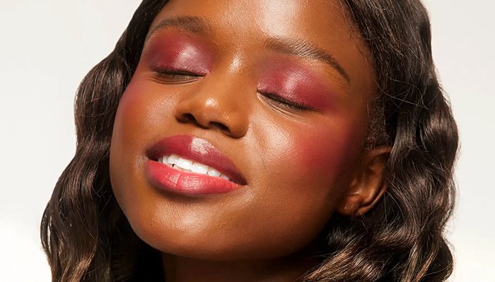 Model with pink eyeshadow and a red lip