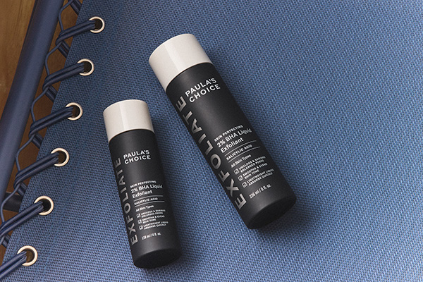 Paula's Choice new the Skin Perfecting 2% BHA Liquid Exfoliant in jumbo size against a scrapbook background