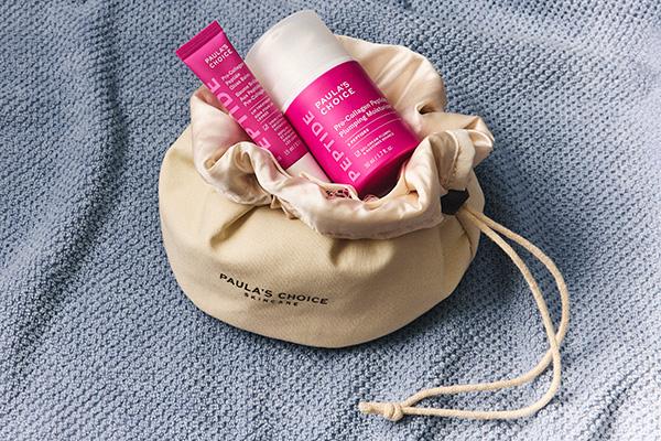 Paula's Choice new Gloss and Glow bundle against a towel