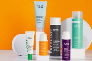 a collection of Paulas choice products against an orange background