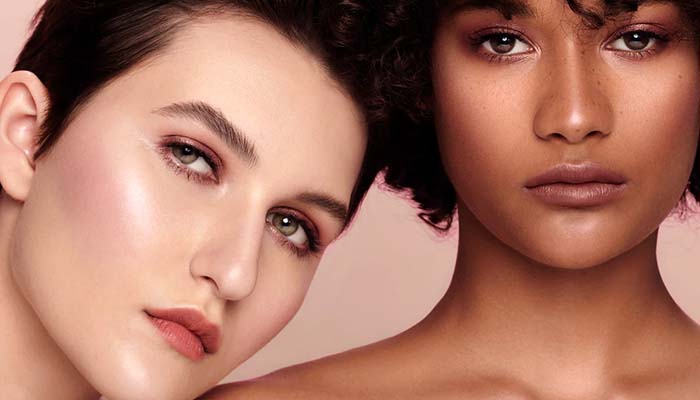 two models with glowy make up