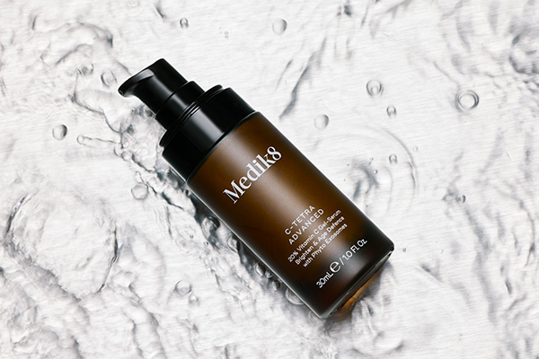 a bottle of medik8s c-tetra serum shot on water