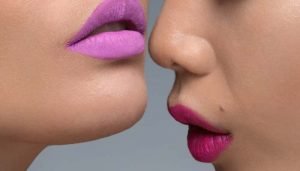 close up of two models lips