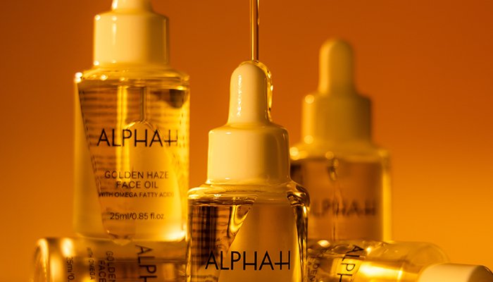 three bottles of alpha h glow daze face oil 