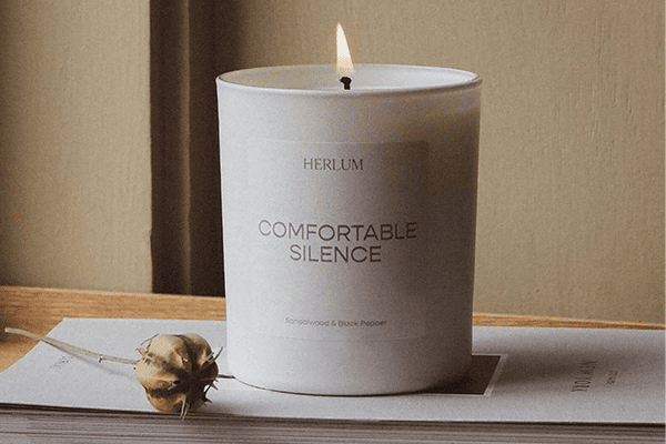Herlum's Comfortable silence candle thats been lit