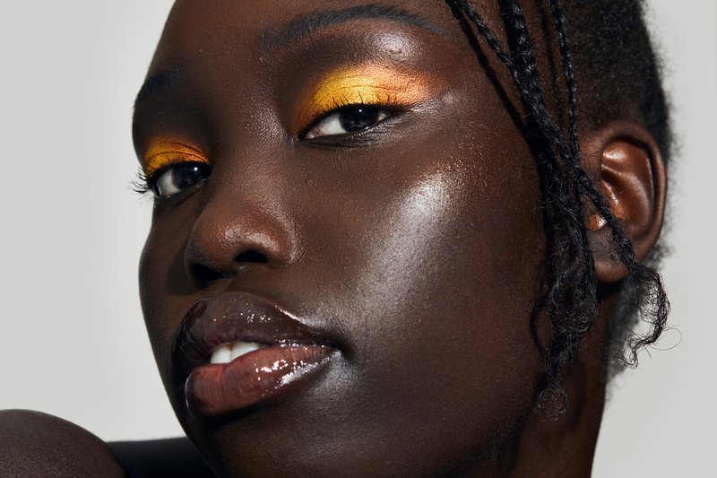 dark skinned model with gold eyeshadow