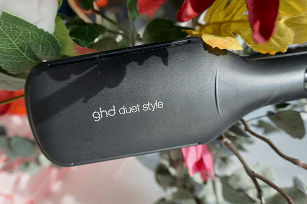 ghd duet styler surrounded by flowers