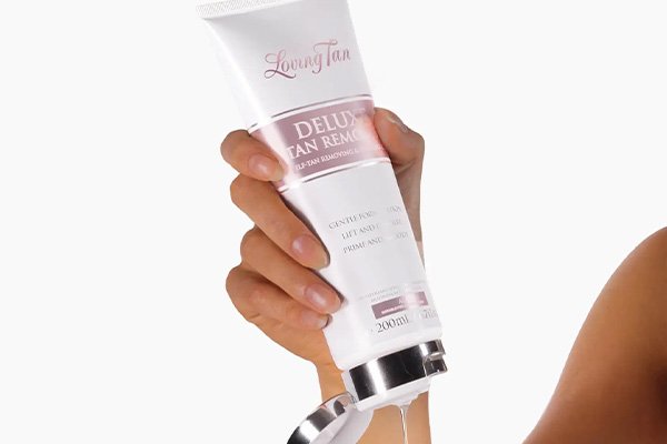 a model squeezing loving tan remover gel 