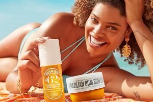 model on a beach with sol de janiero products near her