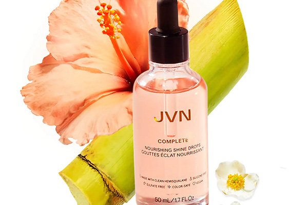 JVN SHINE DROPS AGAINST A FLOWER AND BAMBOO SHOOT