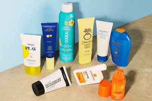 a collection of 8 different sunscreens against a blue background
