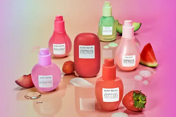 a collection of glow recipe products against a multicoloured background shot in a studio