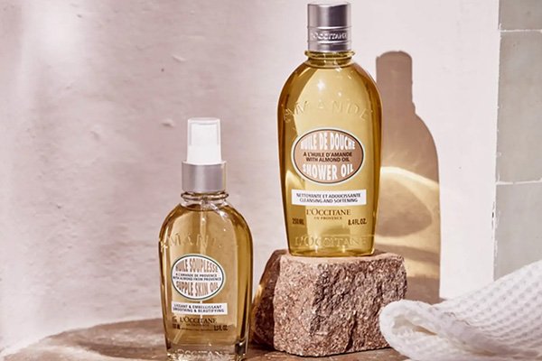 L'OCCITANE almond shower oil collection in batheroom setting 