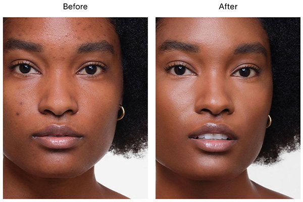 A close up of a before and after image of a female model wearing Hourglass’ Vanish Airbrush Concealer in shade Brandy. 