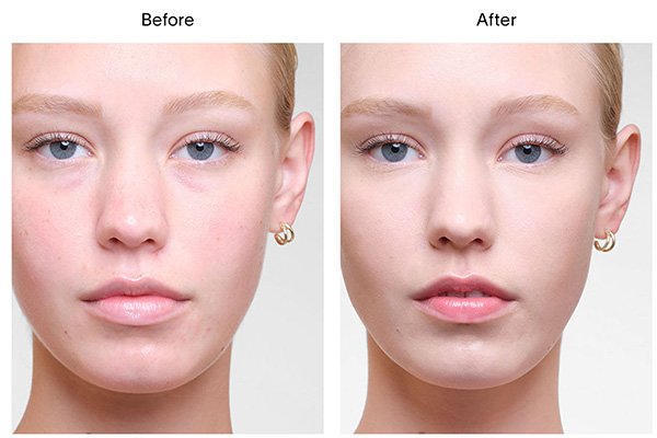 A close up of a before and after image of a female model wearing Hourglass’ Vanish Airbrush Concealer in shade Cedar. 