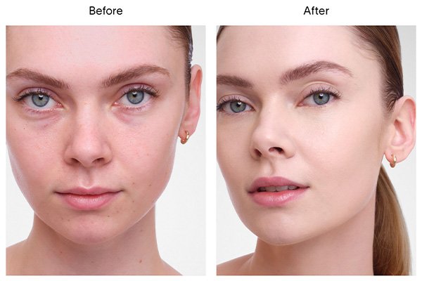 A close up of a before and after image of a female model wearing Hourglass’ Vanish Airbrush Concealer in shade Cotton. 
