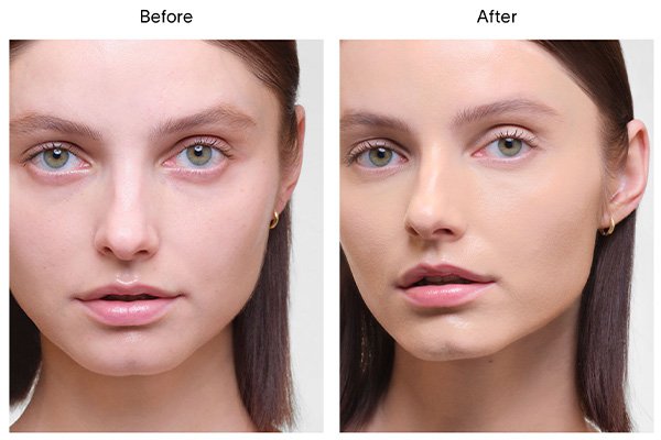 A close up of a before and after image of a female model wearing Hourglass’ Vanish Airbrush Concealer in shade Fawn. 