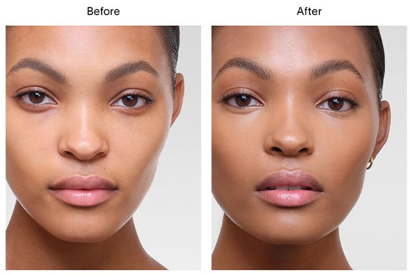 A close up of a before and after image of a female model wearing Hourglass’ Vanish Airbrush Concealer in shade Flax. 