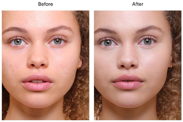 A close up of a before and after image of a female model wearing Hourglass’ Vanish Airbrush Concealer in shade Silk. 