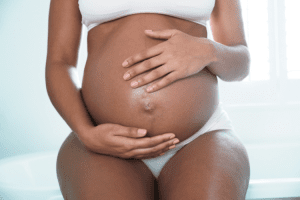 pregnant woman holding baby bump