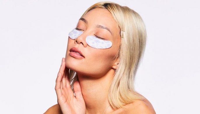 model wearing reusable under-eye masks