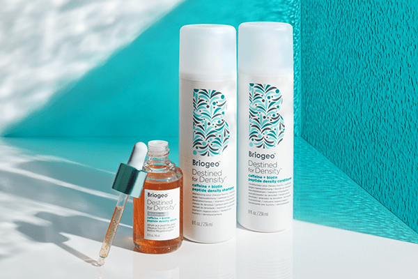 BRIOGEO TRIO OF DESTINED FOR DENSITY RANGE FEATURING THE SERUM AGAINST A TURQUOISE BACKGROUND