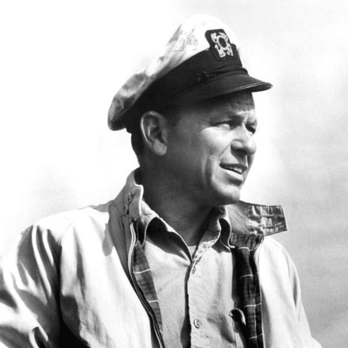 Legendary crooner, Frank Sinatra, wearing a Harrington Jacket and showing off its legendary tartan lining.