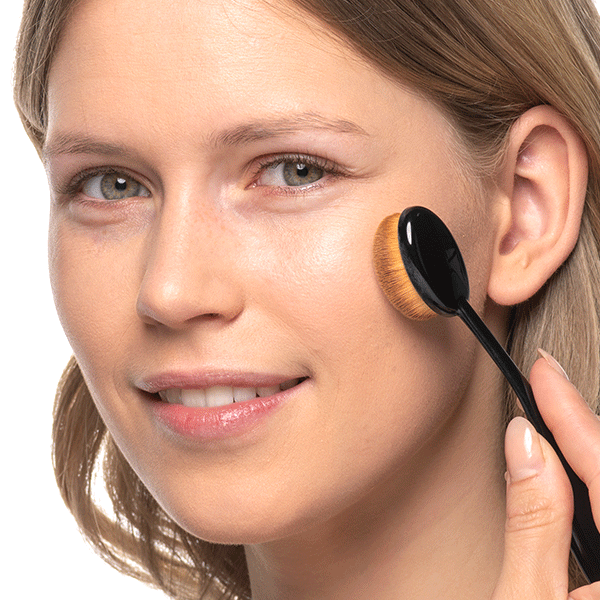 Apply face makeup with an oval foundation brush