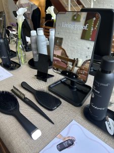 An image of hair products on a dressing table for Living Proof and LOOKFANTASTIC