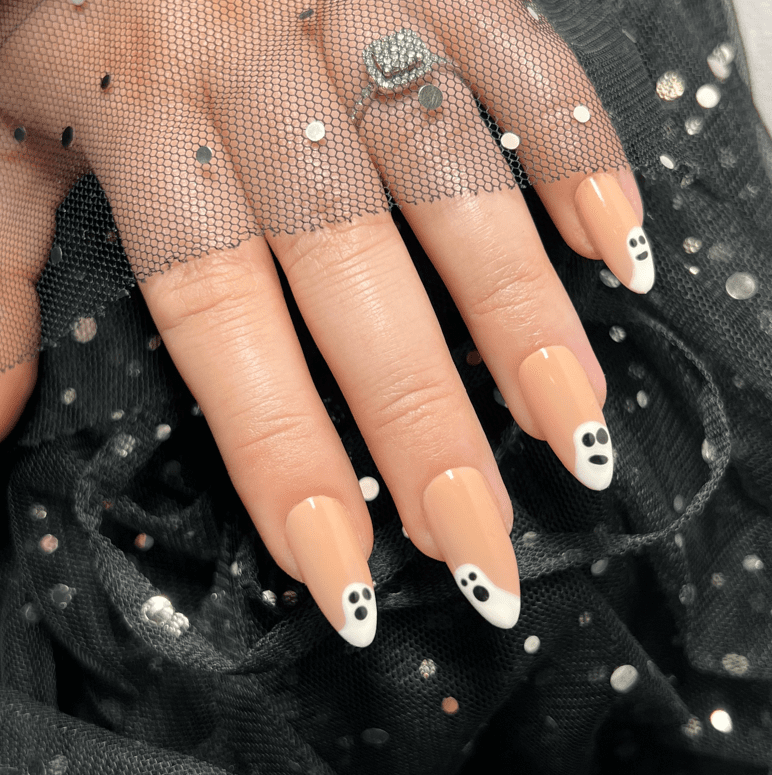 Halloween nails. Nude nails with a ghost design on them