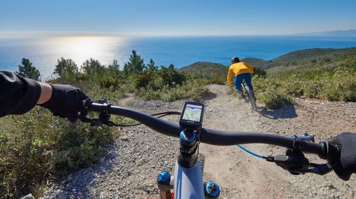 A mountain biker with a Garmin bike computer