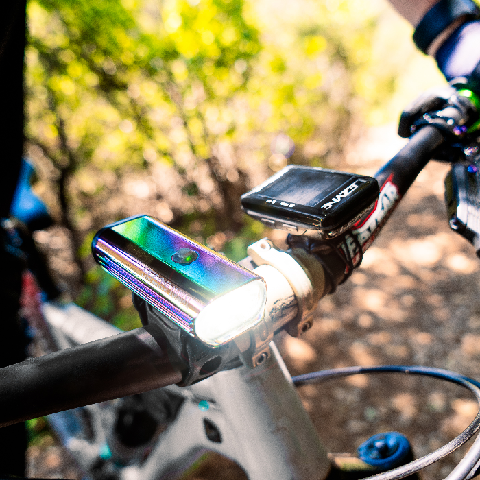 a bike light and bike computer on a handlebar