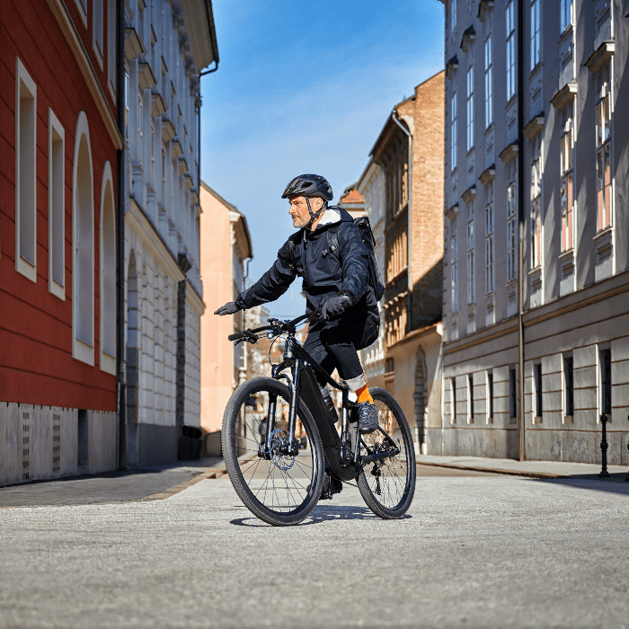 A man riding a bike in an urban environment