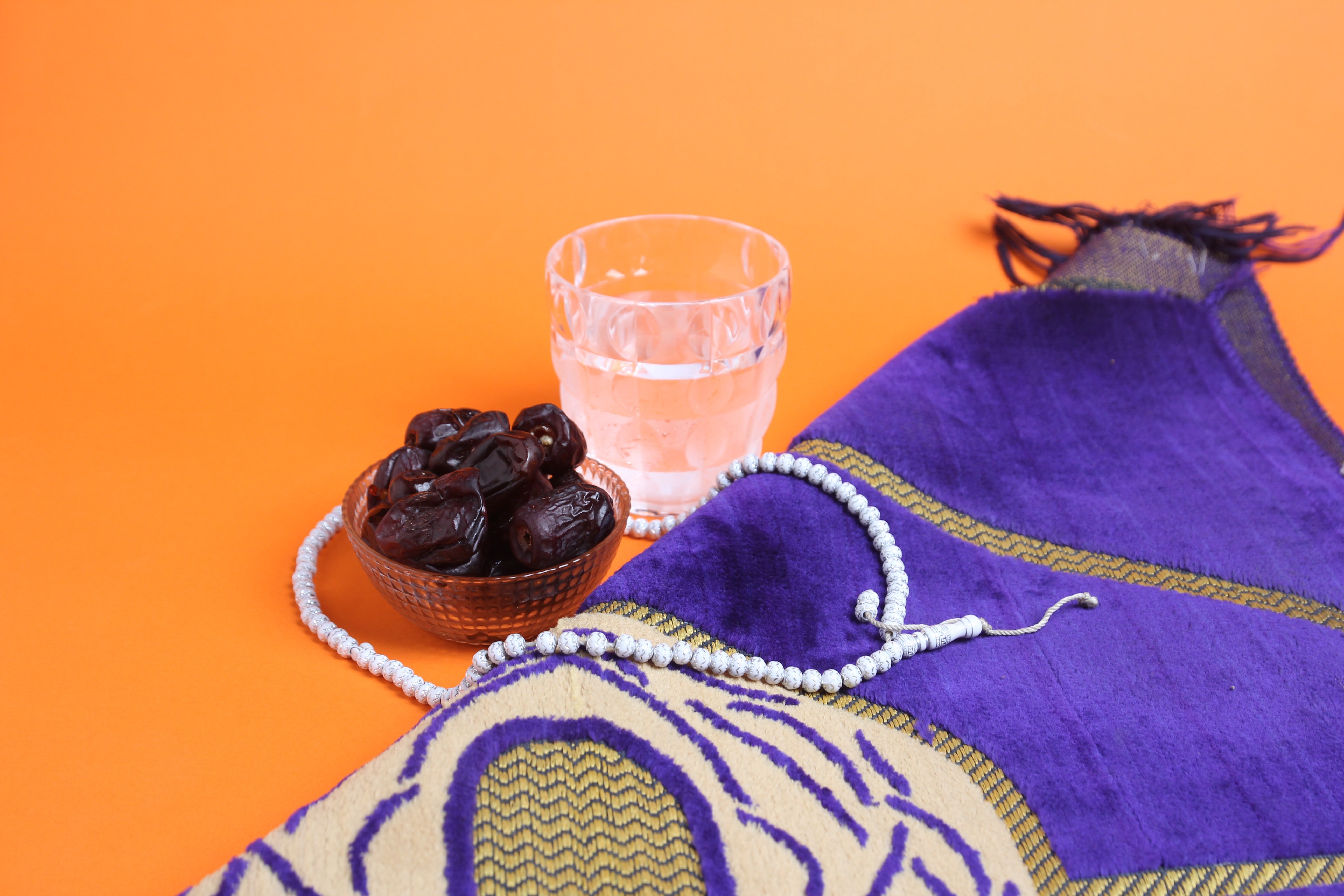 Dates, water, a prayer mat and rosary for ramadan