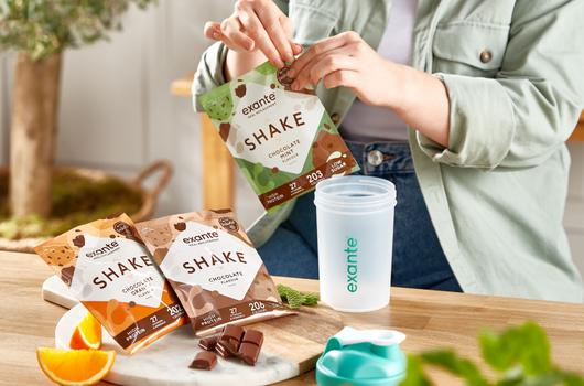 A woman opening a mint flavoured exante prebiotic meal replacement shake