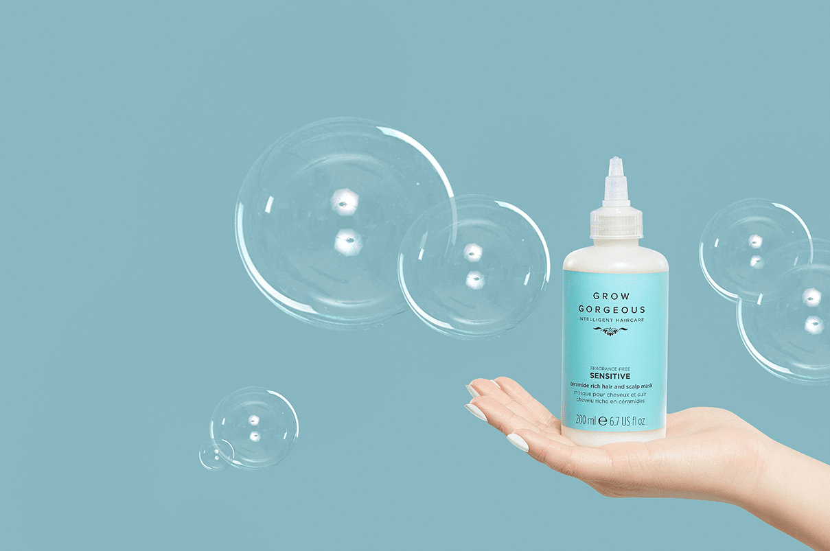 A hand holding up the best scalp treatment for dandruff the Grow Gorgeous sensitive ceramide rich hair and scalp mask.
