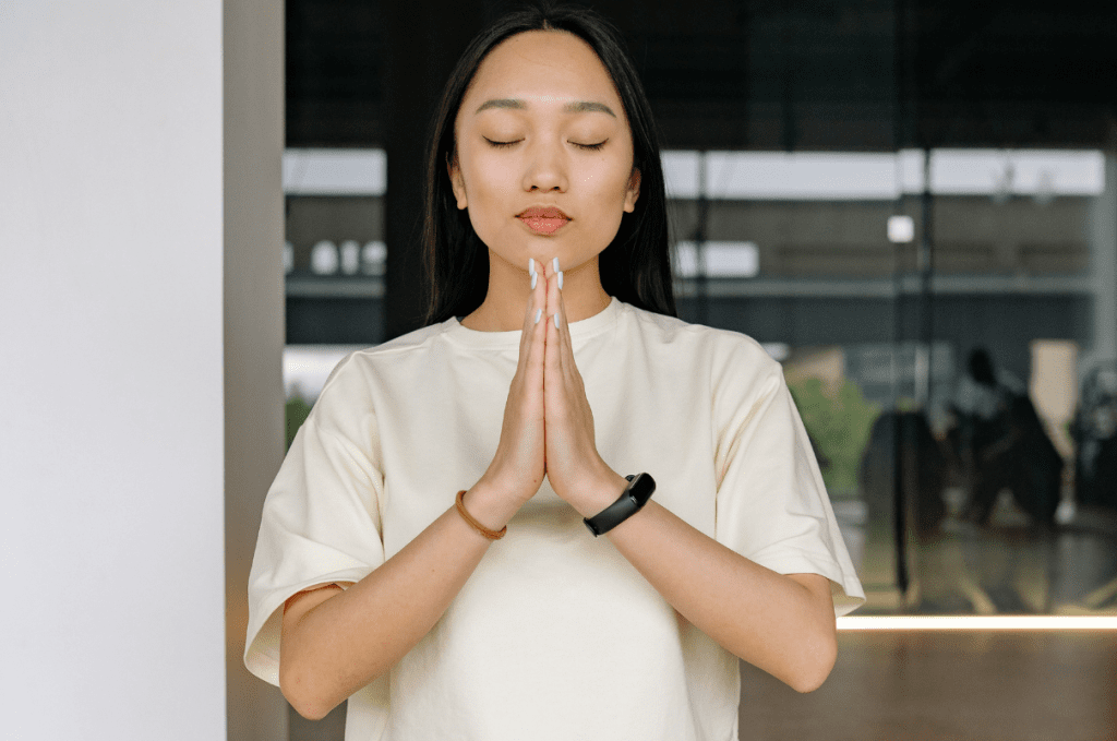 Woman showing praying hands technique