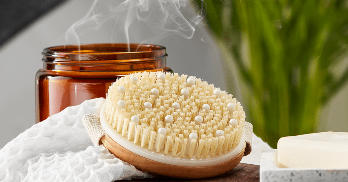 mio dry body brush with candle background