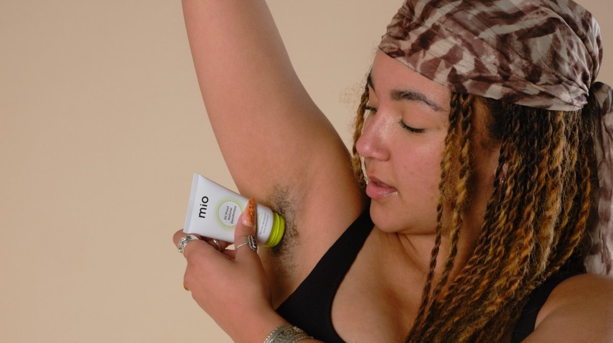 woman applying natural deodorant