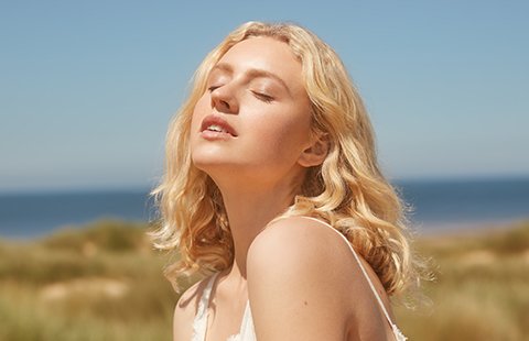 Model in sunshine on beach