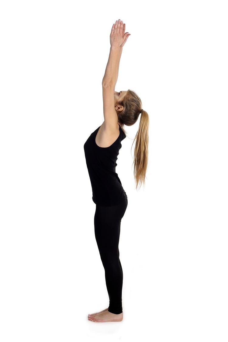 Flexible woman performing backbend with raised arms on yoga mat - a Royalty  Free Stock Photo from Photocase