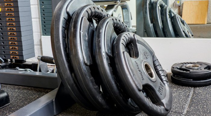 weights on the floor of a gym