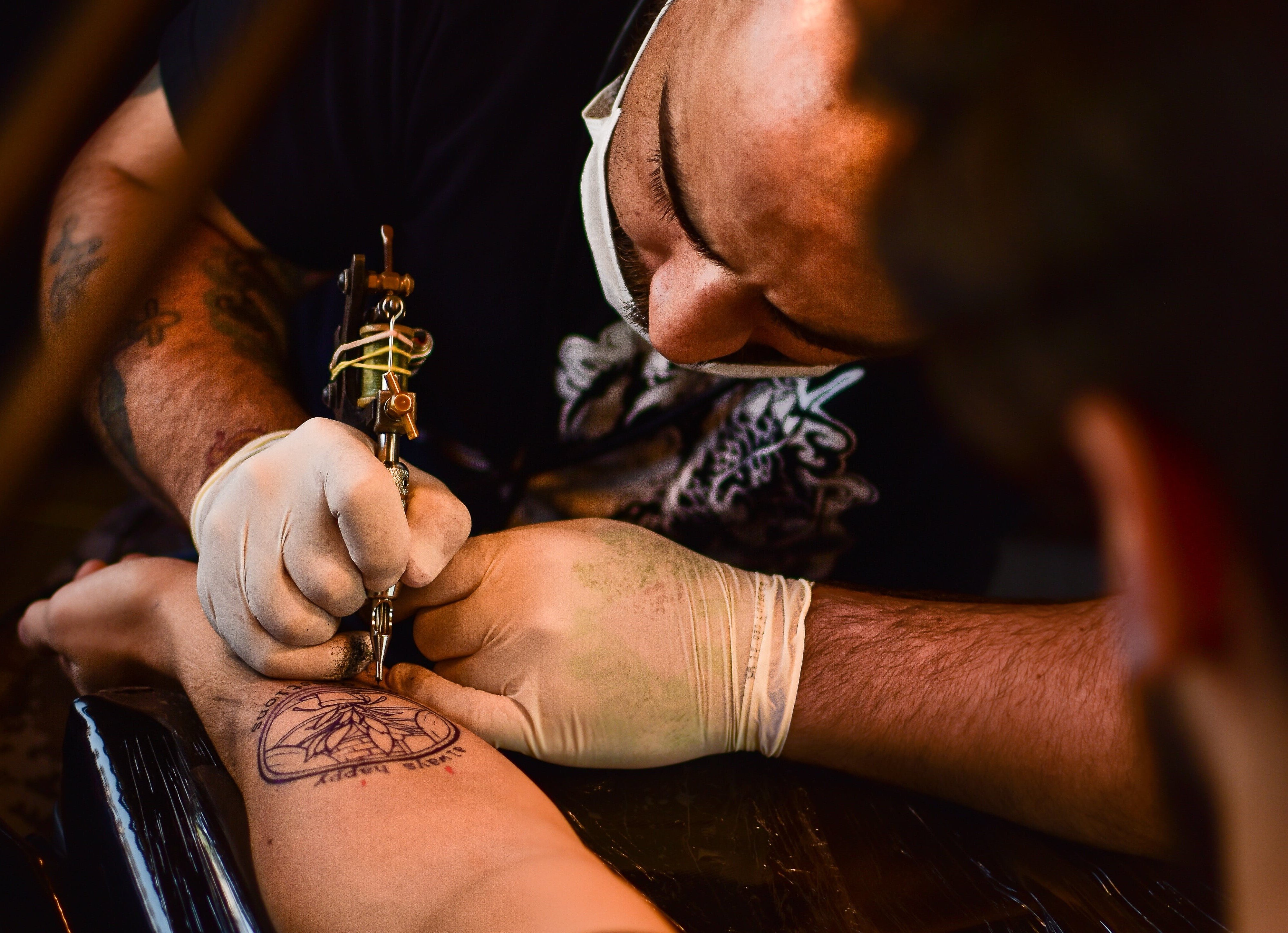 man getting a tattoo
