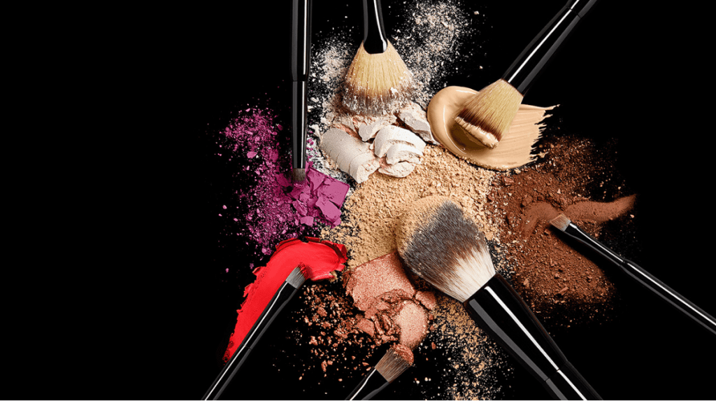 Makeup brushes surrounded in powder product