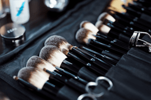 row of various makeup brushes including powder foundation brush and stippling brush