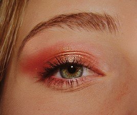 Close up of models eye with shimmery y2k 2000s eye makeup