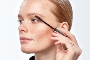 woman applying Eyeko mascara for bold lashes