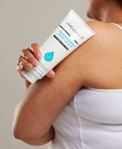 Woman with KP on her arms using AMELIORATE Transforming Body Lotion