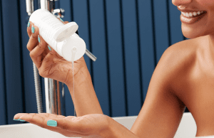 woman using conditioner in bath