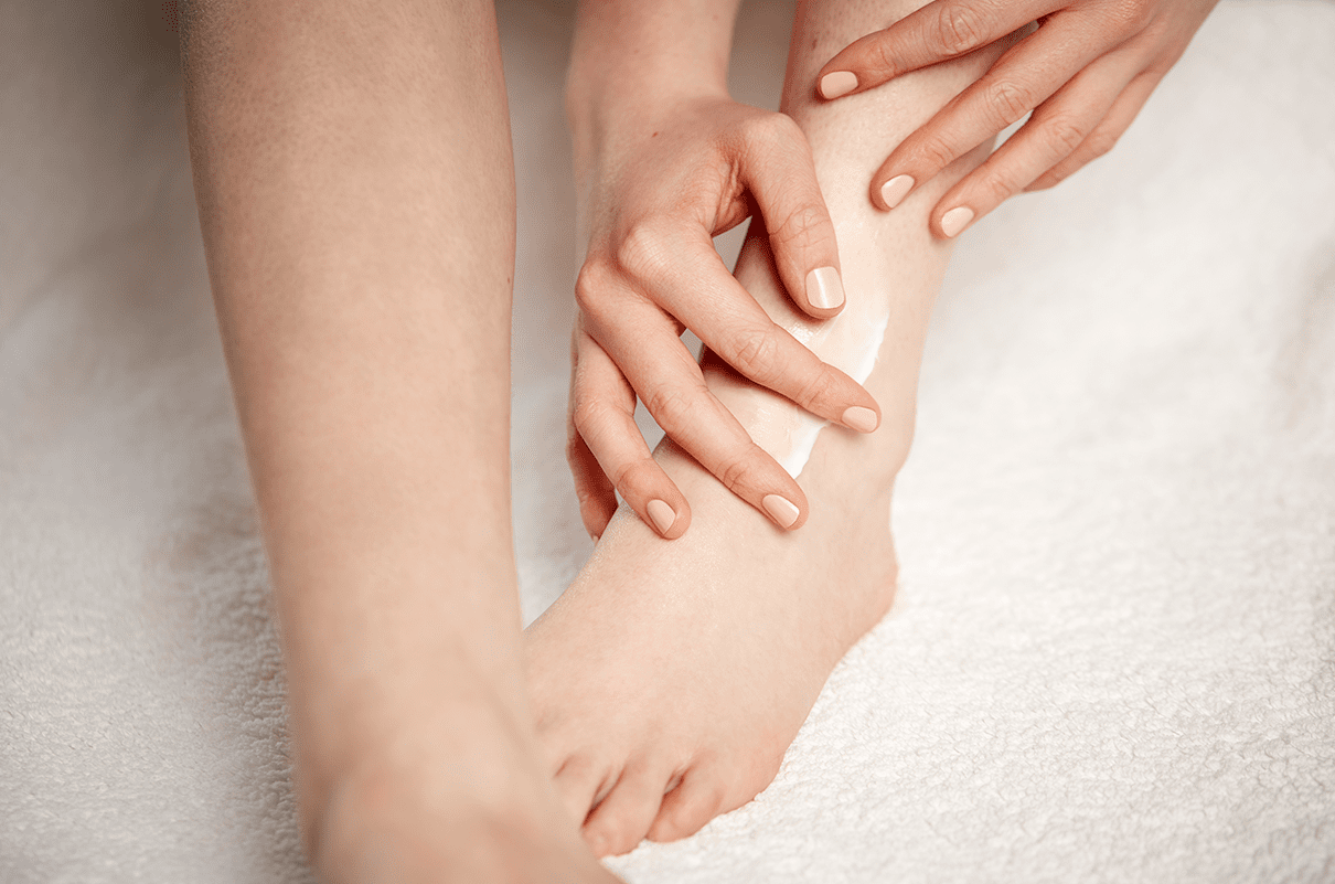 woman applying foot cream